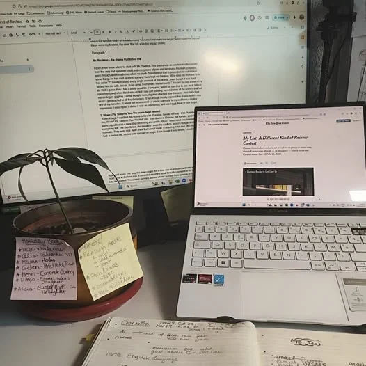 Picture of computer and a screen displaying writing