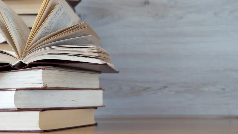 picture of a stack of books on a neutral background