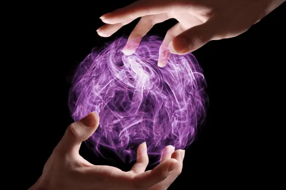 two hands shaping an orb of energy